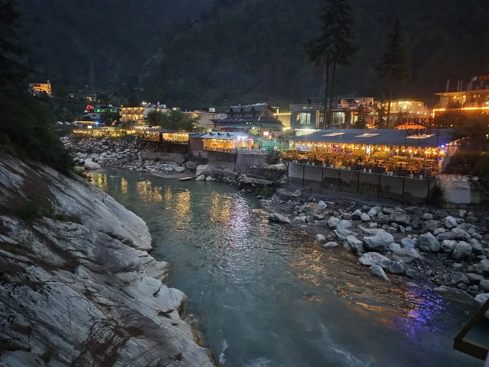 Kasol camp lit up at dusk