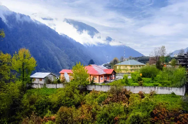 Colourful mountain village near Manali at dawn