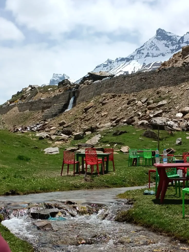 Prayer flags before a towering Himalayan peak